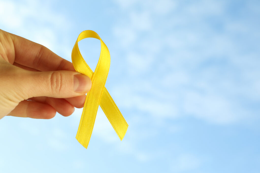 female hand hold childhood cancer awareness ribbon 2025 03 26 02 57 59 utc
